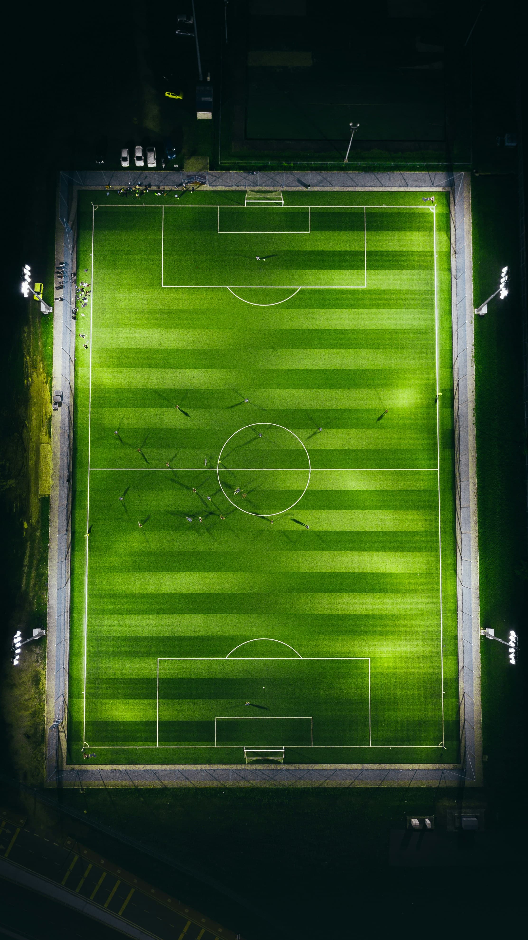 Aerial view of a football pitch with tactical markings - representing data-driven match analysis